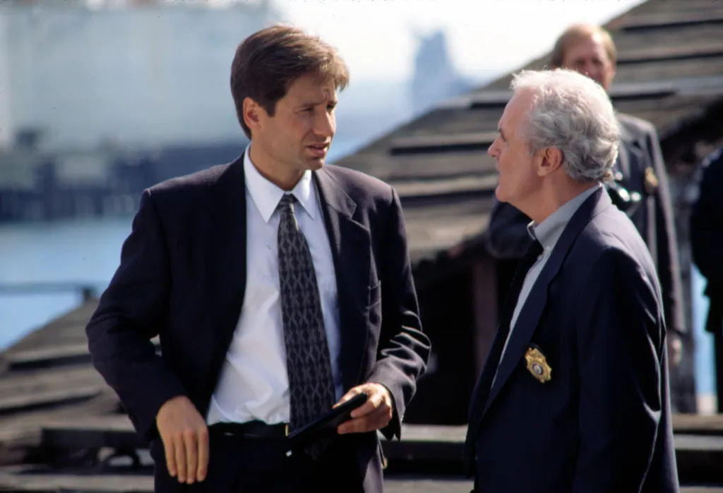 David Duchovny and James Handy talking in 