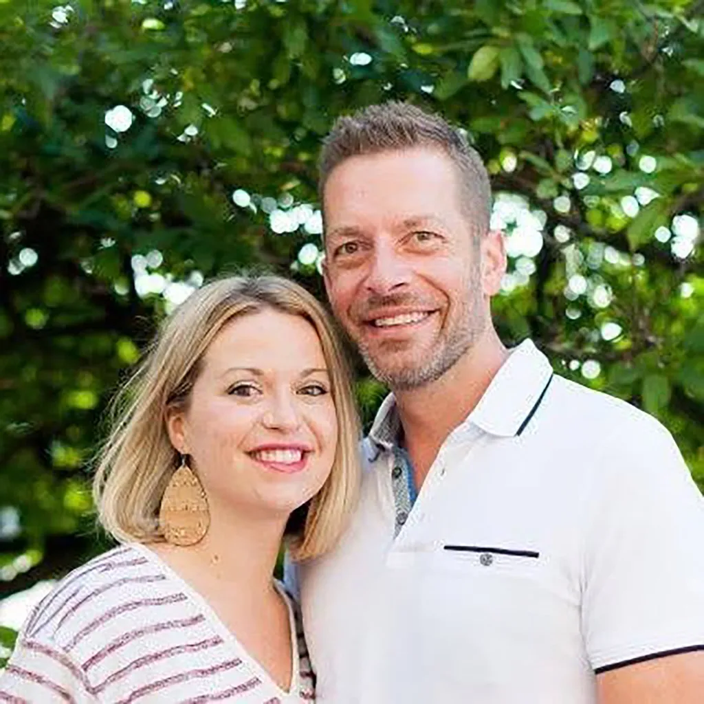A photo of Amanda and Kristopher Karolkiewicz outside. 