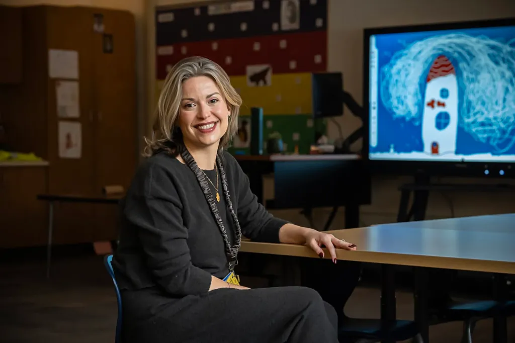 A photo of Amanda Karolkiewicz at a desk. 