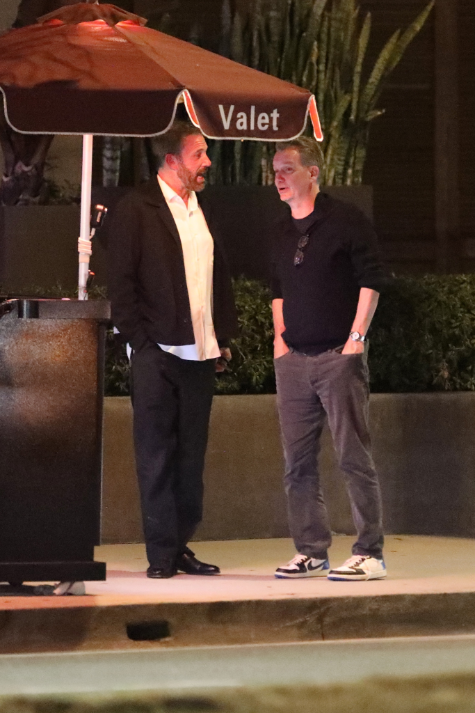 Ben Affleck talking with Sean Bailey outside Baltaire restaurant under a