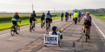In Iowa, a Democrat’s Uphill Battle for Senate Comes With Wheels