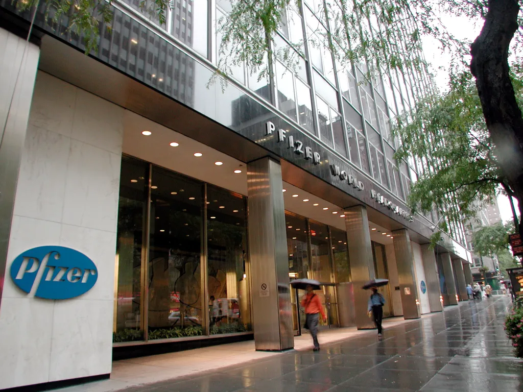 The Pfizer World Headquarters building at 235 E 42nd St, NYC, with the company logo on the left and 