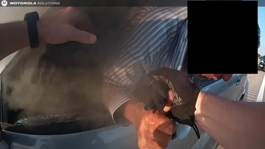 Person getting rescued from a smoke-filled car.