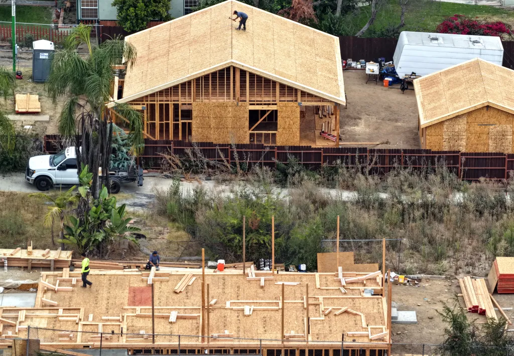 Aerial view of two homes under construction following the Eaton Fire in Altadena, California.