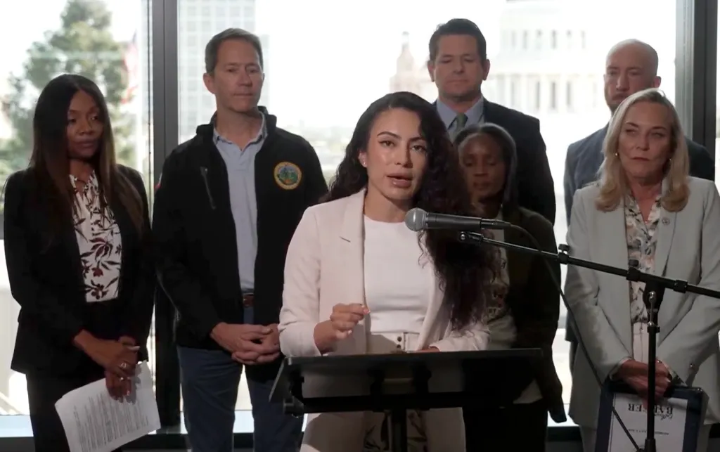 Senator Pérez speaking at a press conference with other officials.