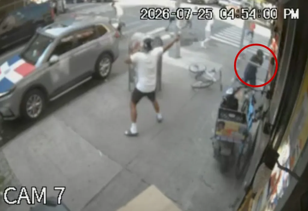 Surveillance camera footage of a street with a car, a person in a white t-shirt and shorts, and a person circled in red on the sidewalk.