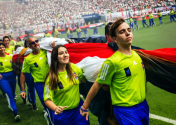 It Takes Coordination (and Many Arms) to Unfurl a World Cup Flag