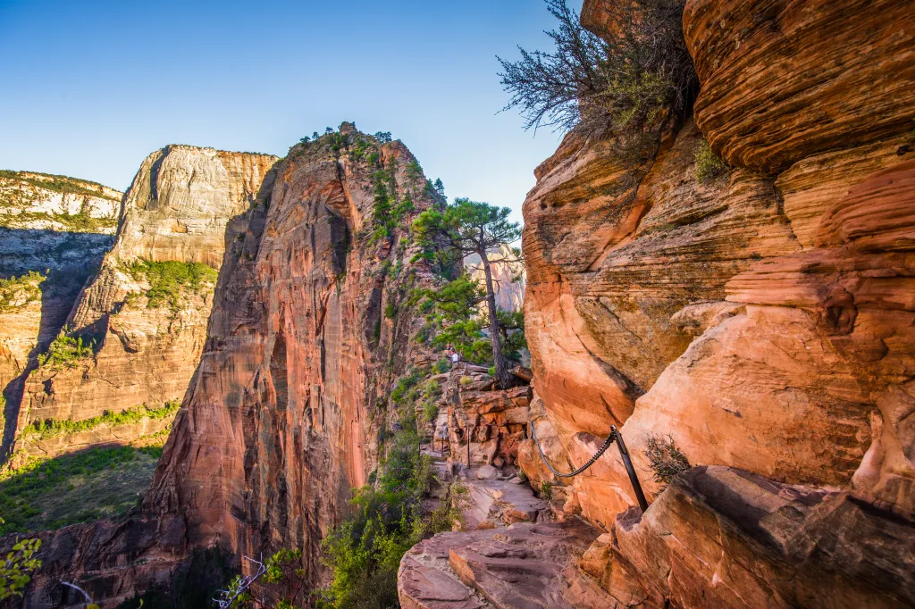 Angels Landing hiking trail with chains for safety along a cliff face in Zion National Park, Utah.