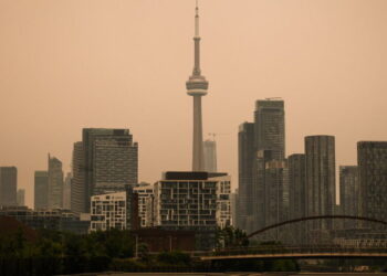 Toronto Under an Orange Sky as Wildfire Smoke Pours Into the U.S. Northeast