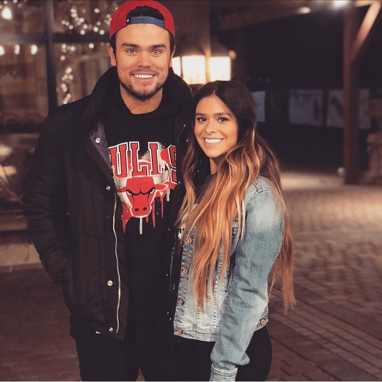 A man and a woman, Tate and Taylor Paul, smiling at the camera.