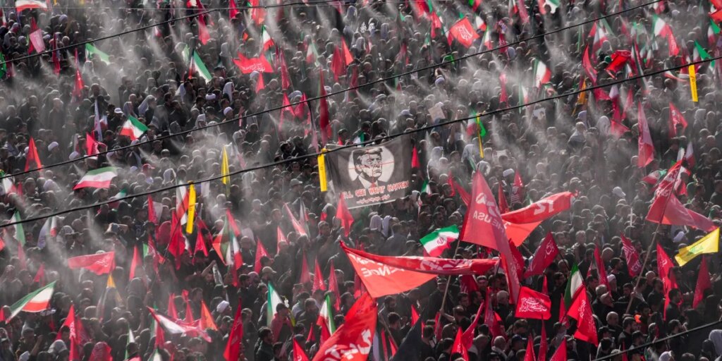 Iranians demand revenge at funeral ceremonies for supreme leader killed during war, while his replacement has yet to appear to mourn his father
