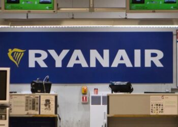 A man was partly sucked out of a broken window on a Ryanair plane shortly after takeoff, but fellow passengers pulled him back