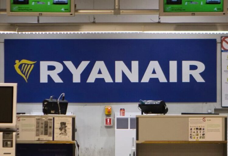 A man was partly sucked out of a broken window on a Ryanair plane shortly after takeoff, but fellow passengers pulled him back