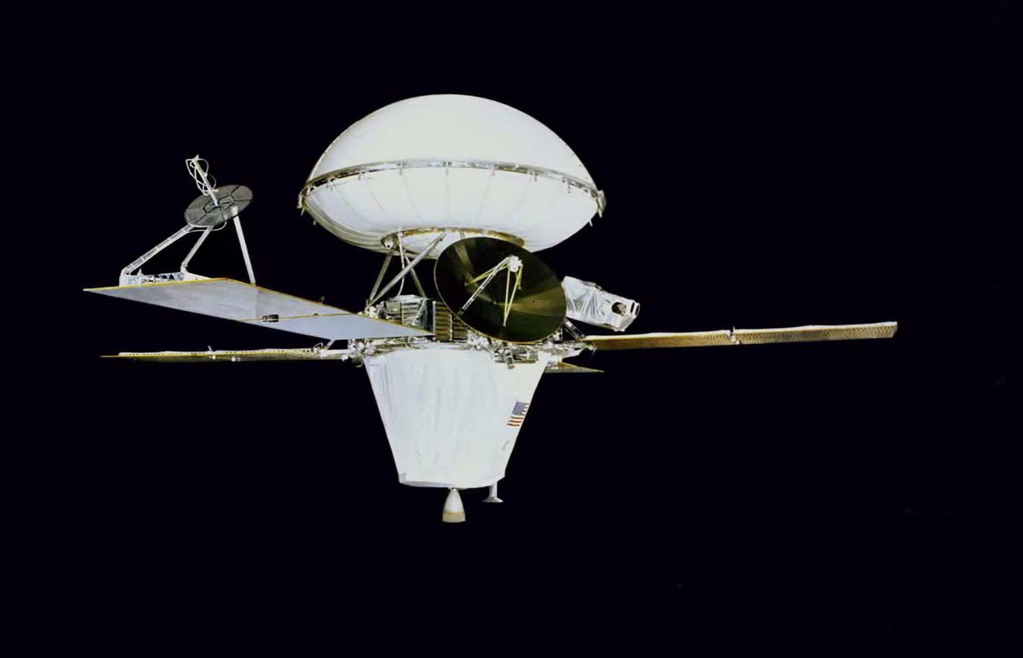 An image of the Viking 1 spacecraft in transit configuration—a rounded shell attached to the top of conical body with four small solar panels attached