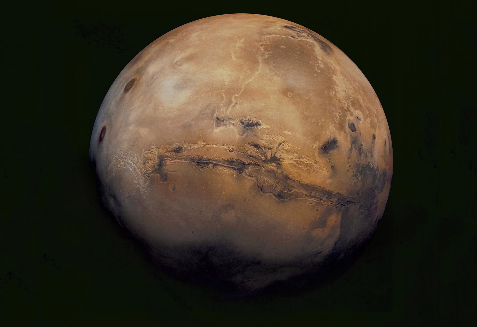 An image of the full globe of Mars, seen from space