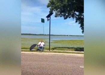 Wild Footage Shows Man Blocking Flock Camera With Comically Gigantic Protest Sign