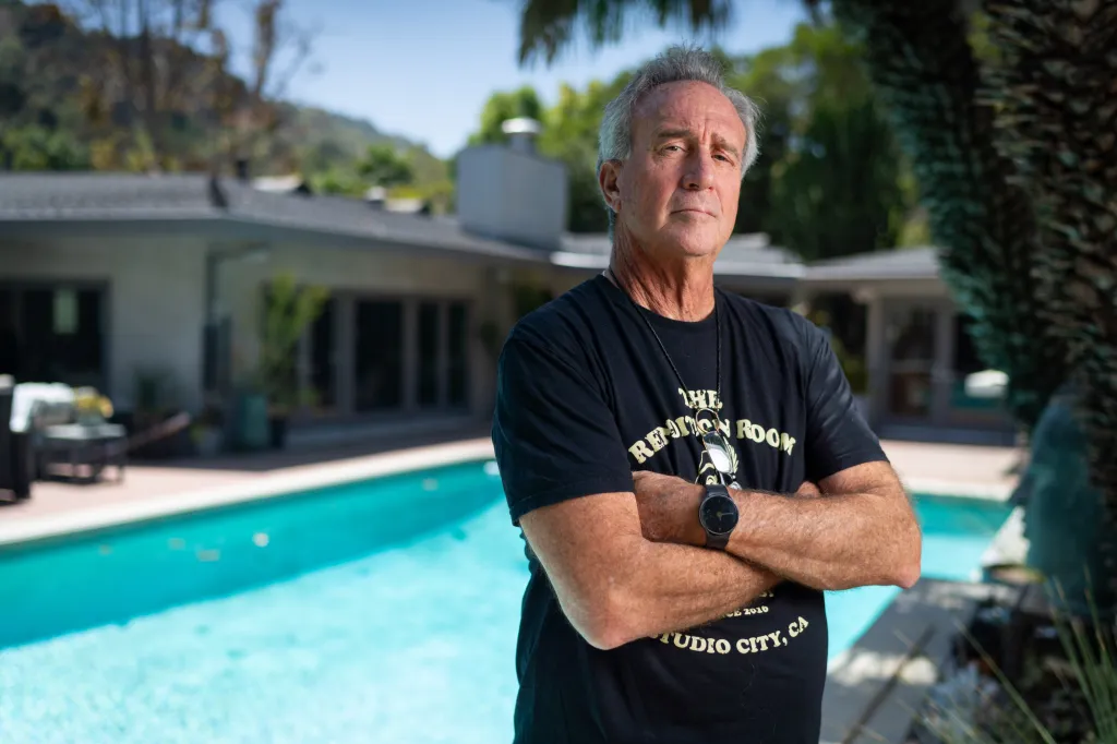 Matt Epstein, president of the Sherman Oaks Homeowners Association, standing outdoors with his arms crossed.