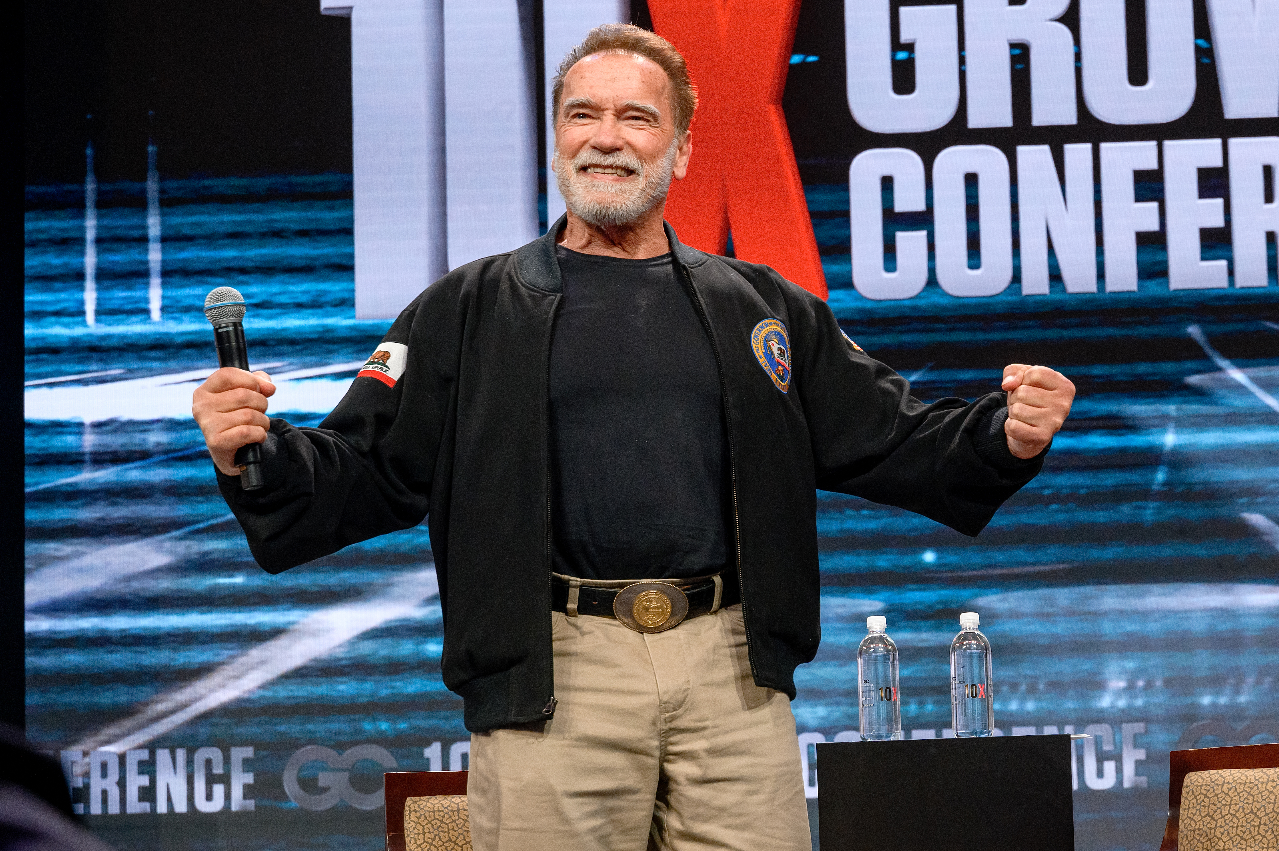 Arnold Schwarzenegger speaking at the 10X Growth Conference.
