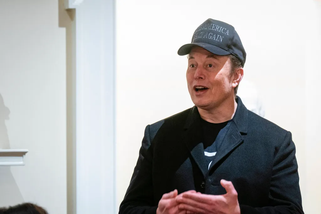 Elon Musk speaking while wearing a 