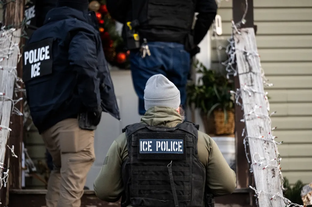 ICE agents outside a home during an enforcement operation in Chicago, Illinois, on Jan. 26, 2025.