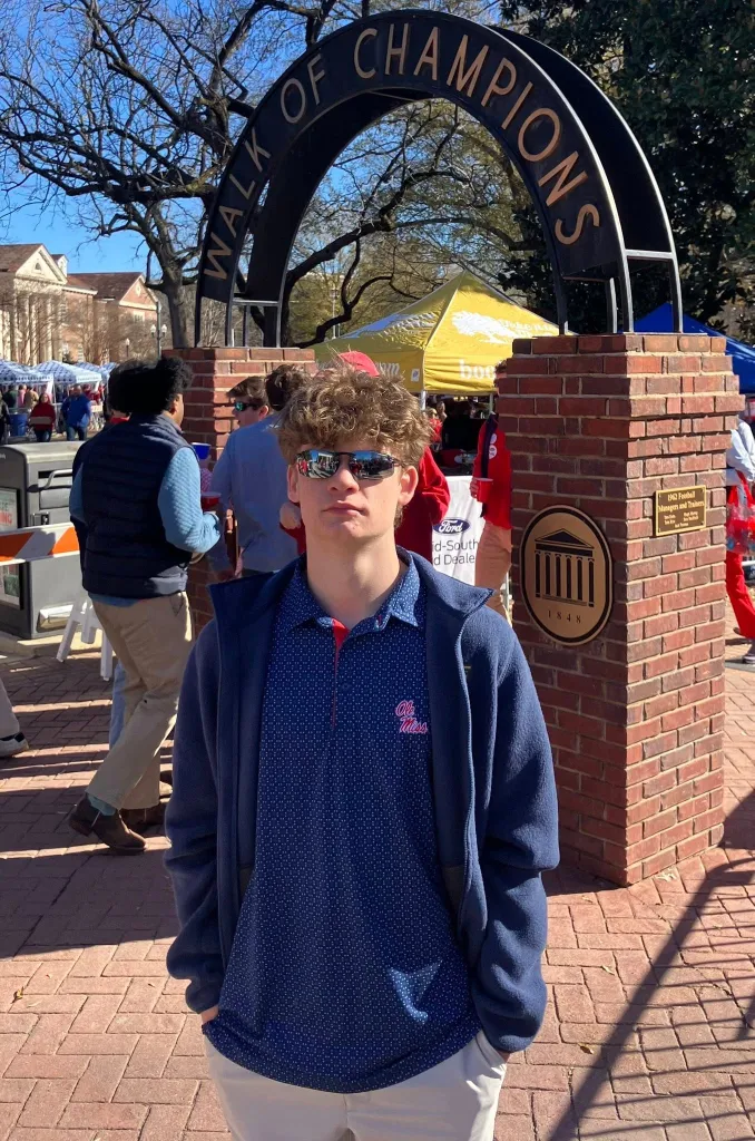 Brandon Baker standing in front of the 