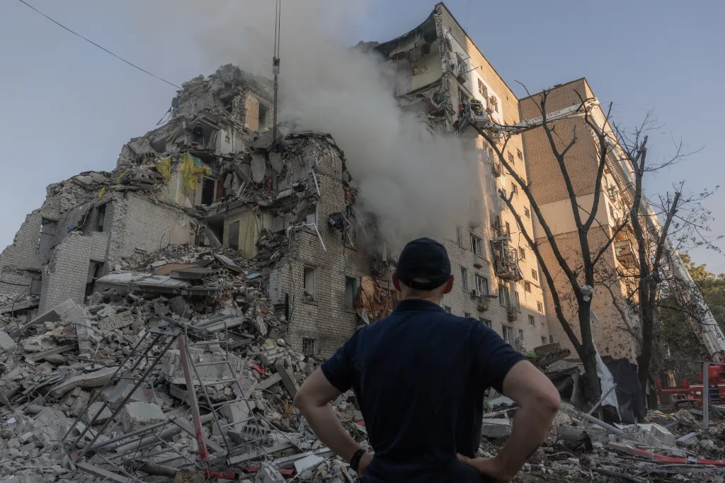 A man looks the remains of a residential building destroyed during a Russian air attack on July 2, 2026.