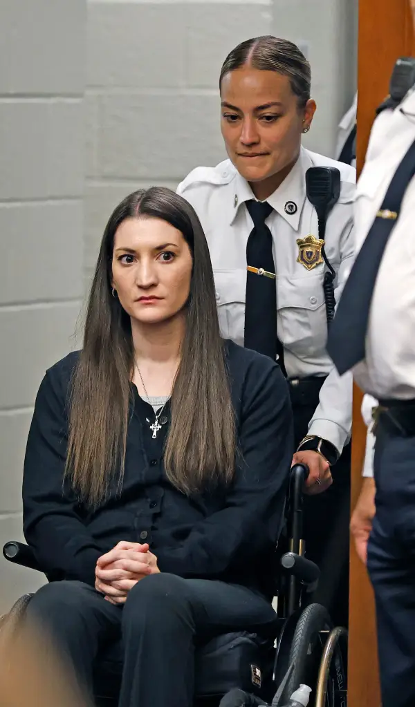Lindsay Clancy in a wheelchair, being brought into Plymouth Superior Court.