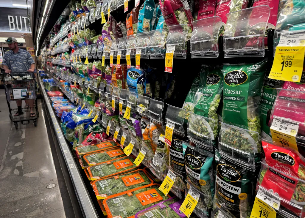 Taylor Farms salad bags on display in a Safeway store.