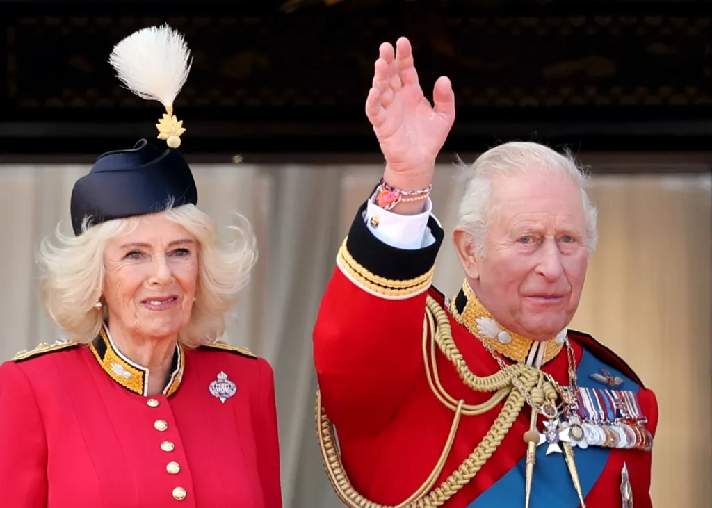Queen Camilla and King Charles III wave from the balcony during Trooping The Colour.
