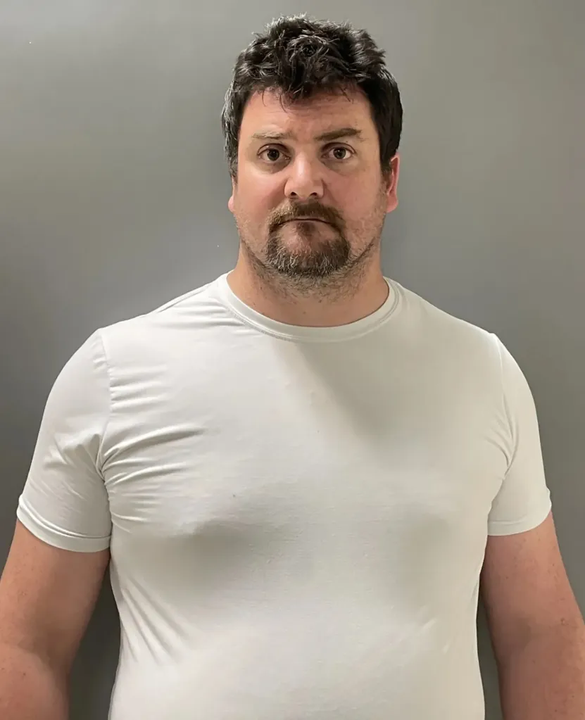 James Mulhern III faces 12 counts of abuse of a minor after investigators found videos of 12 female students undressing.
