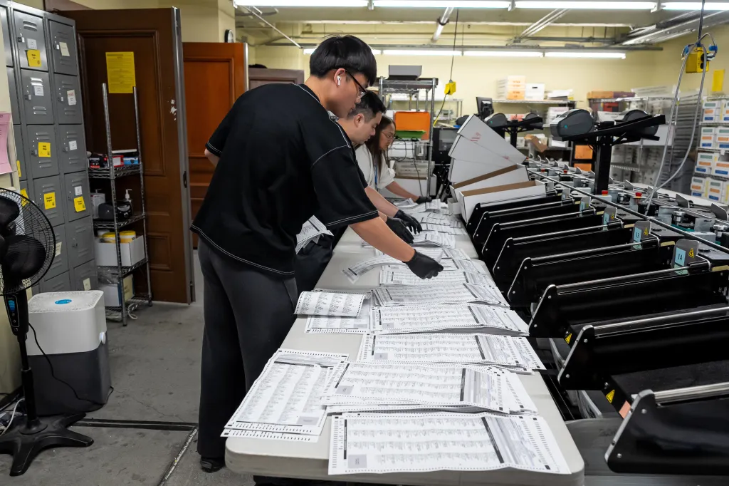 Election workers process mail-in ballots after a primary election at San Francisco County's election operations on June 9, 2026.