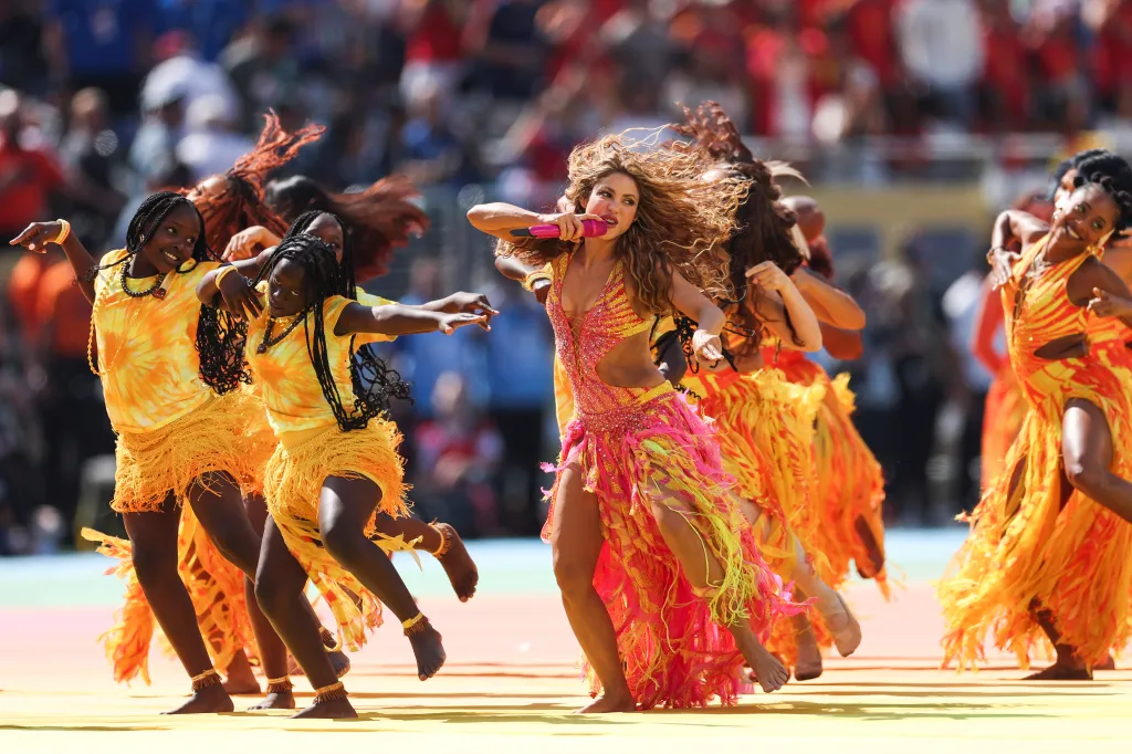 Shakira performing at the 2026 World Cup halftime show with backup dancers.