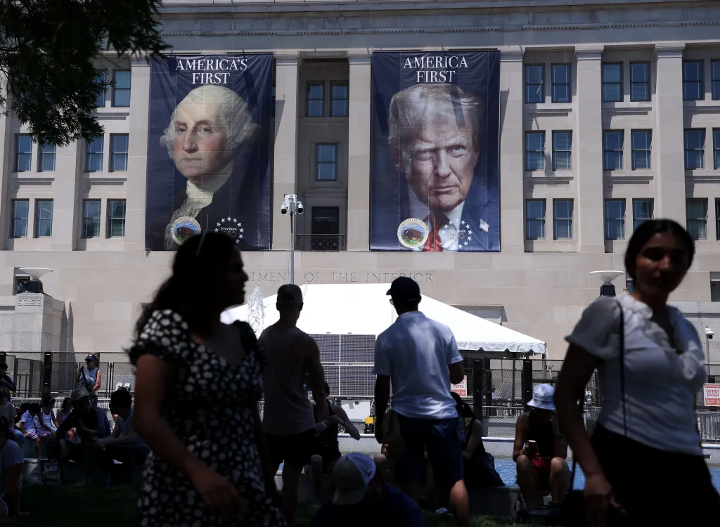 Two large banners depicting George Washington and Donald Trump, each with