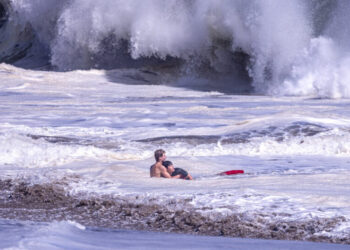 Teenage Lifeguard Fights Intense Waves to Bring Boy to Safety