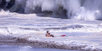 Teenage Lifeguard Fights Intense Waves to Bring Boy to Safety
