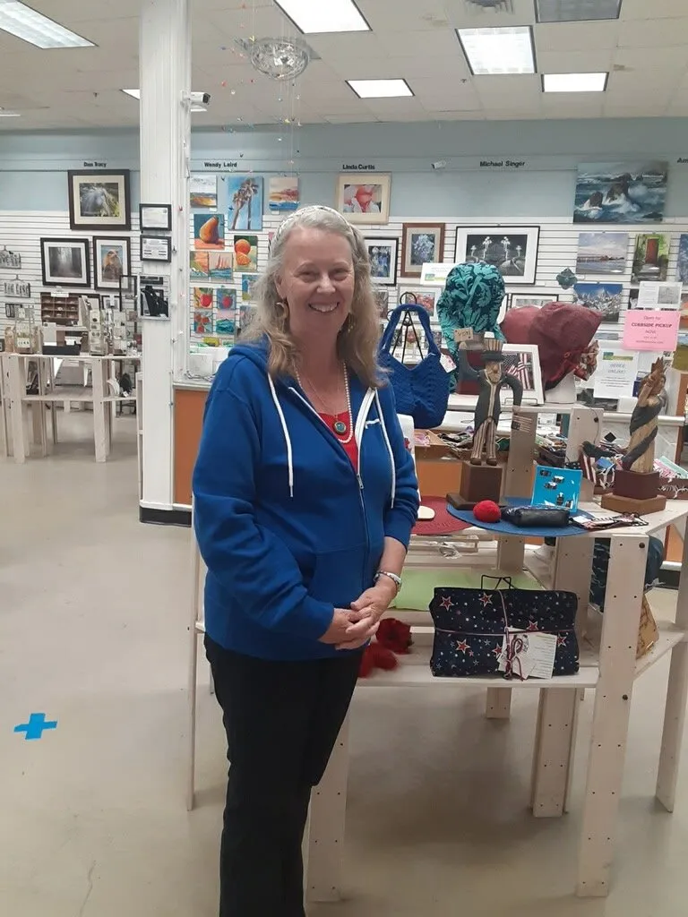 Rachell Summers, a Capitola artist, standing in a gallery.