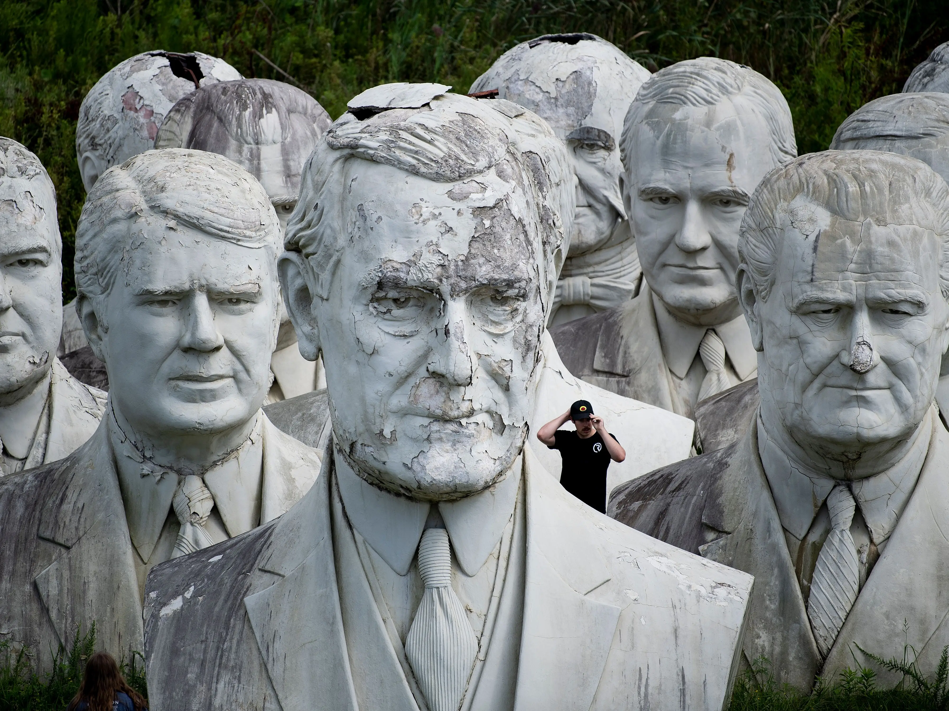 Tourists look minuscule next to the giant statues.