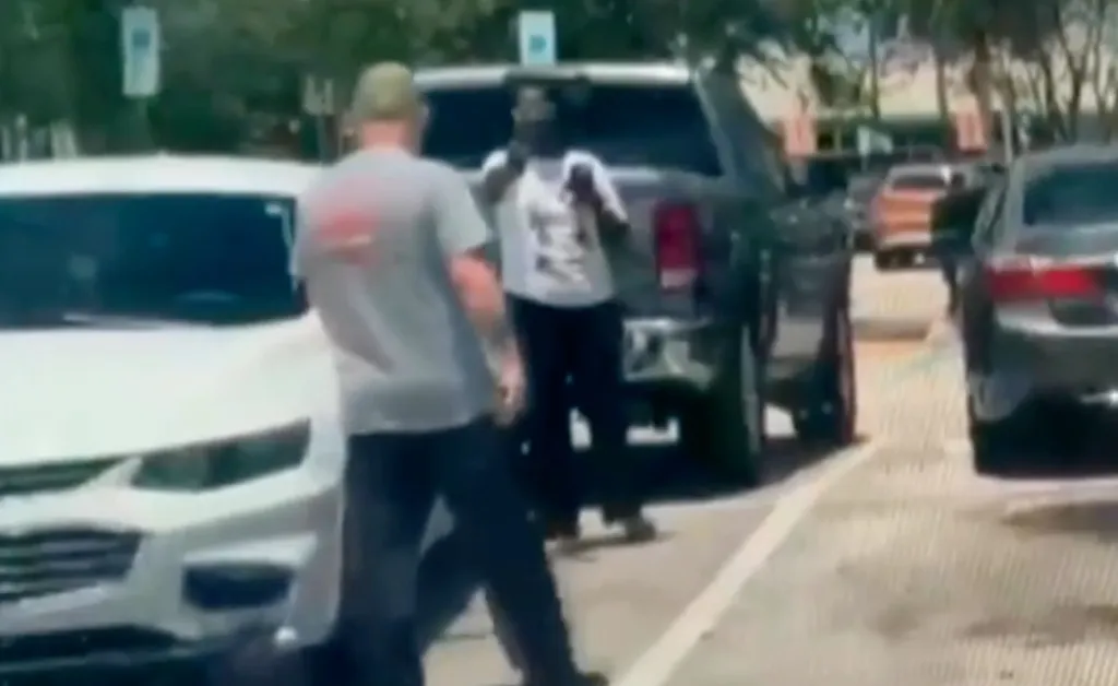 The two shoppers repeatedly pointed at each other during the argument and, at one point, the man put both his arms in the air as they stood in an empty parking space.