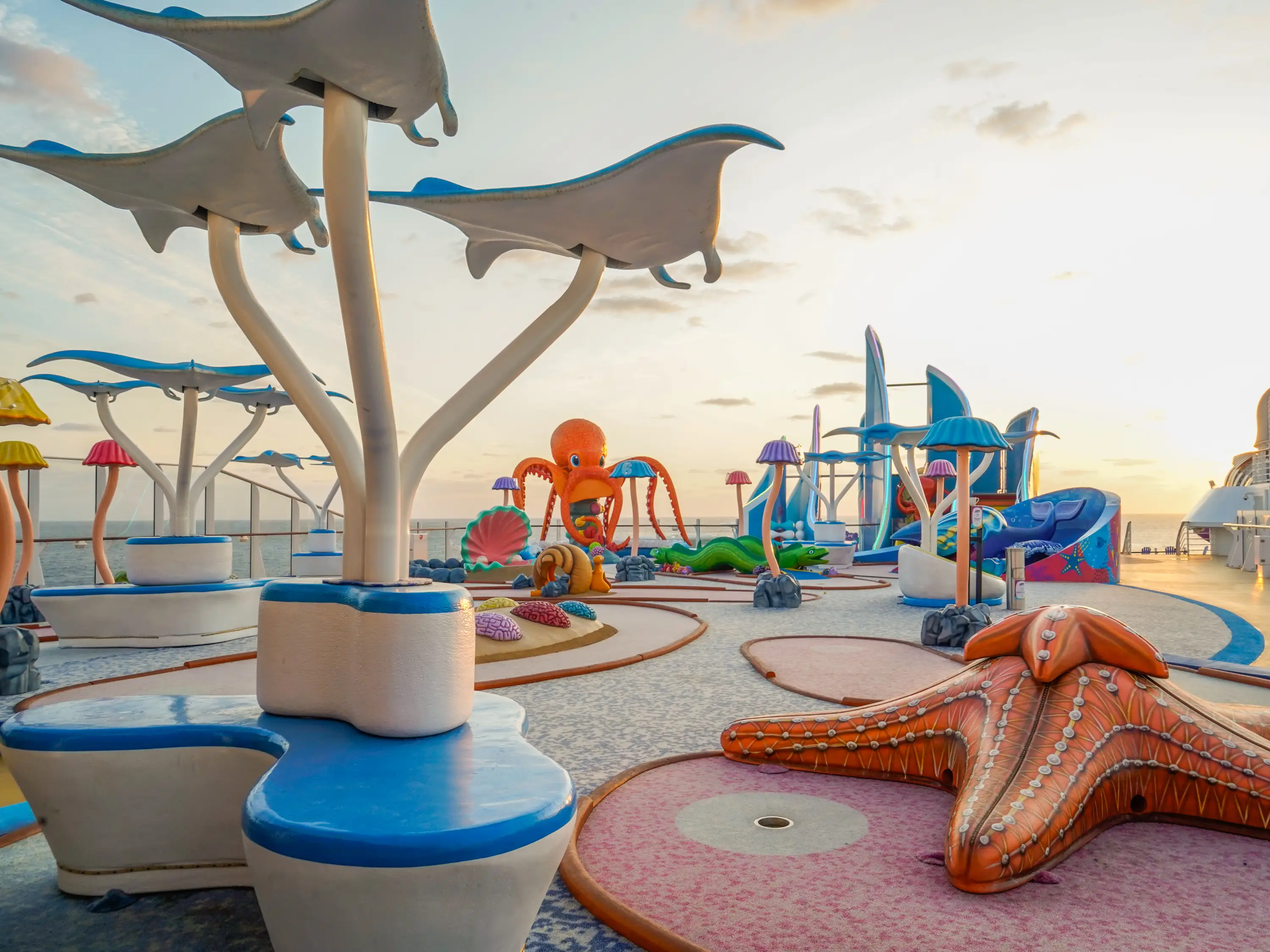 An empty mini golf course with a sea creature theme on a cruise ship