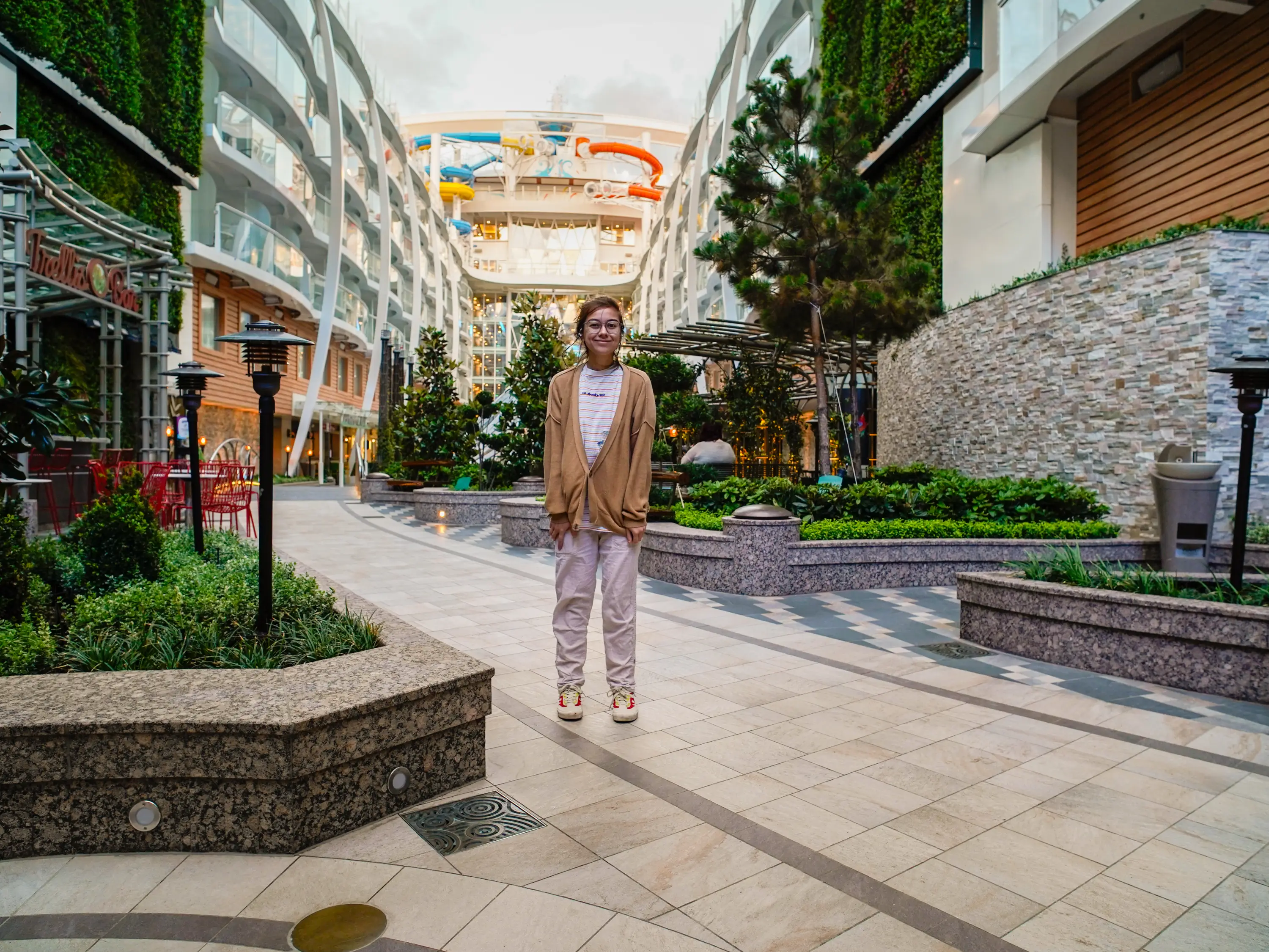 The author stands on an outdoor deck in the middle of a cruise ship