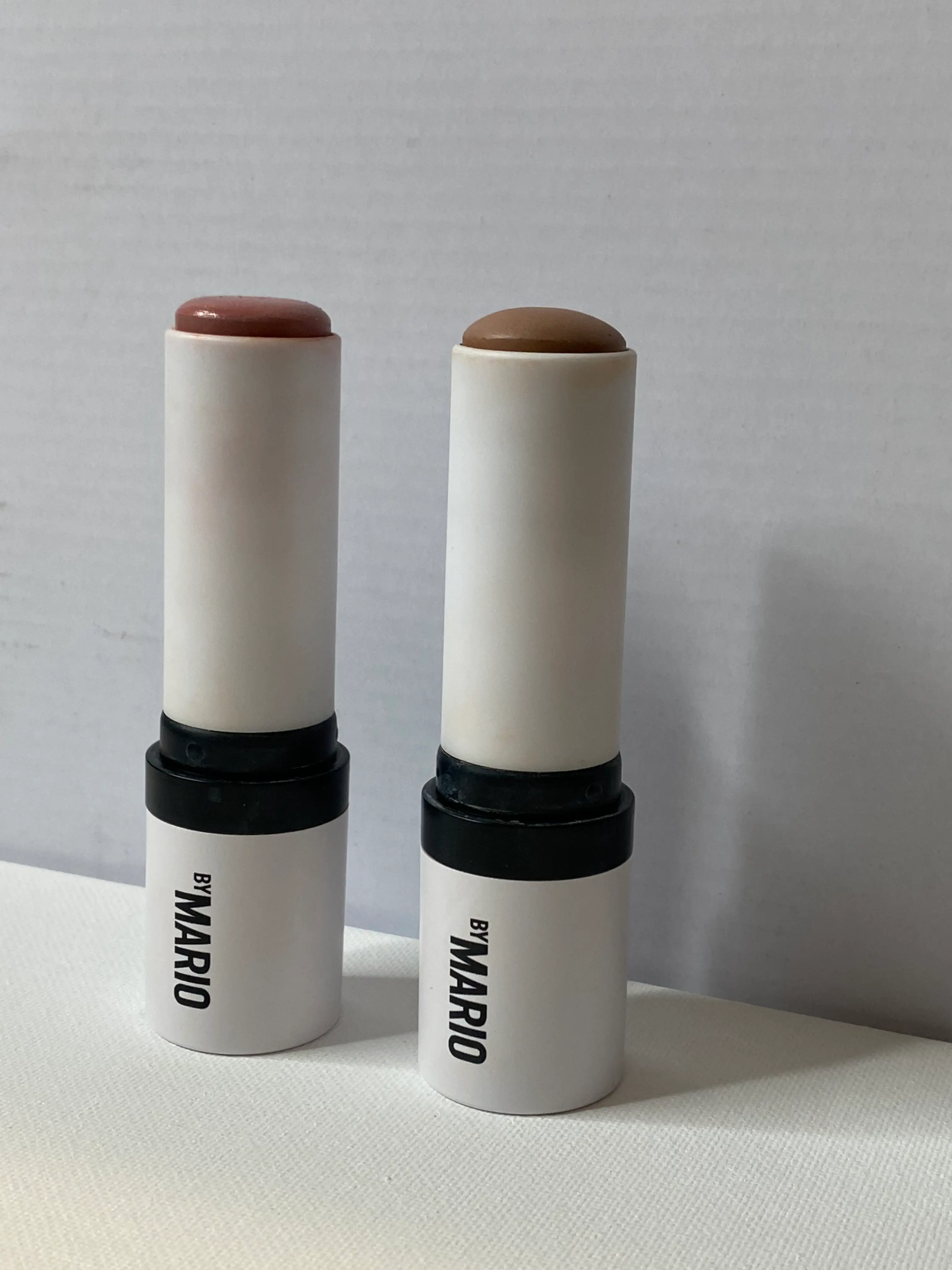 Two cream makeup sticks with 