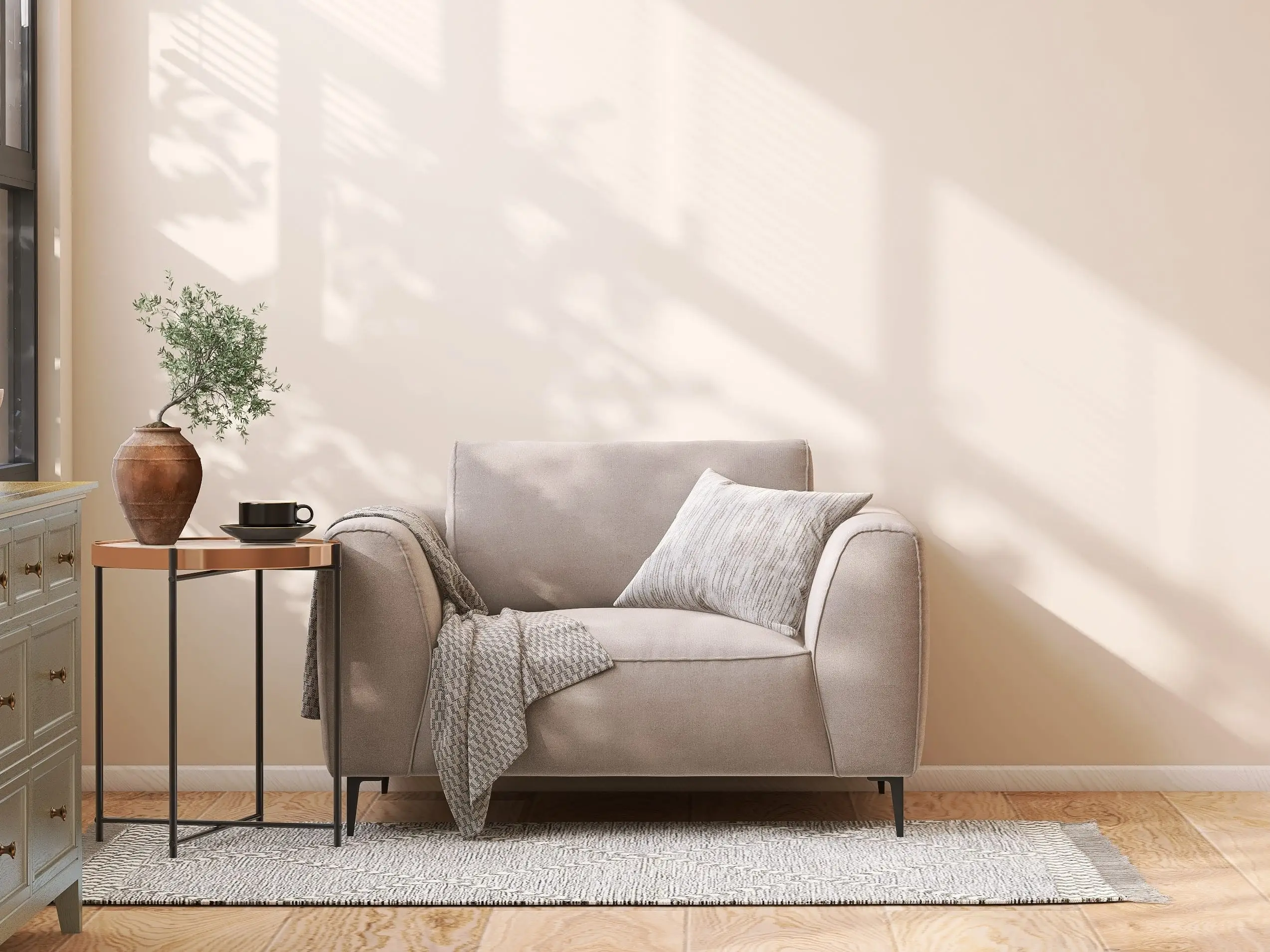 Gray chair with a gray throw blanket