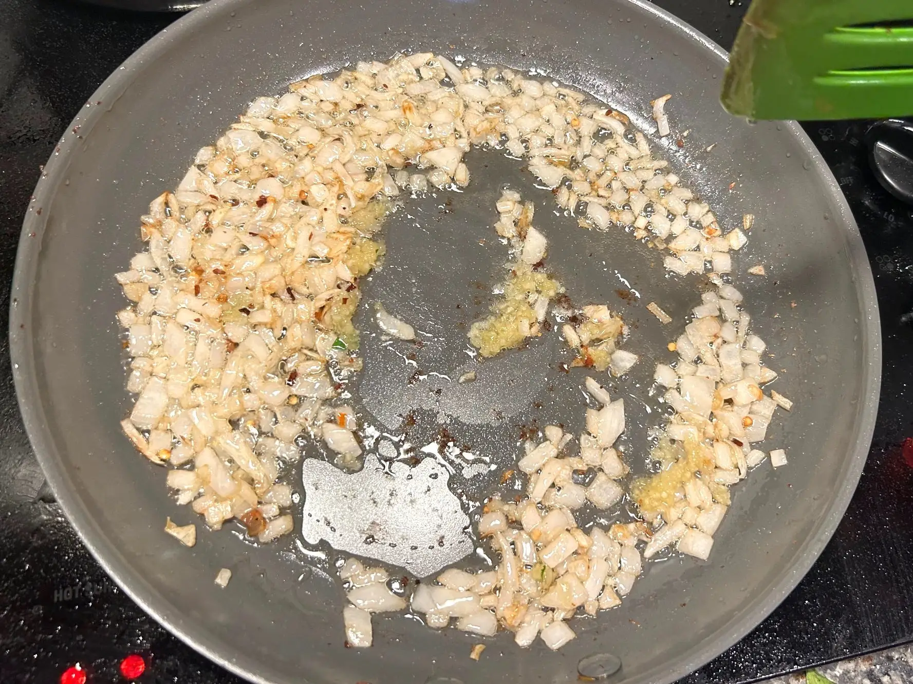Cooking onions for Giada De Laurentiis' Bucatini All'Amatriciana pasta