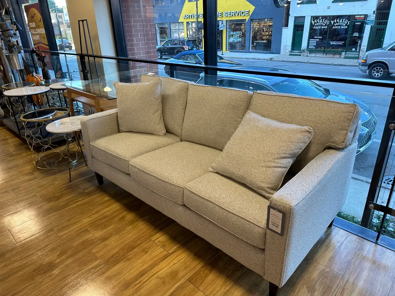 A gray sofa on the floor display at Homegoods