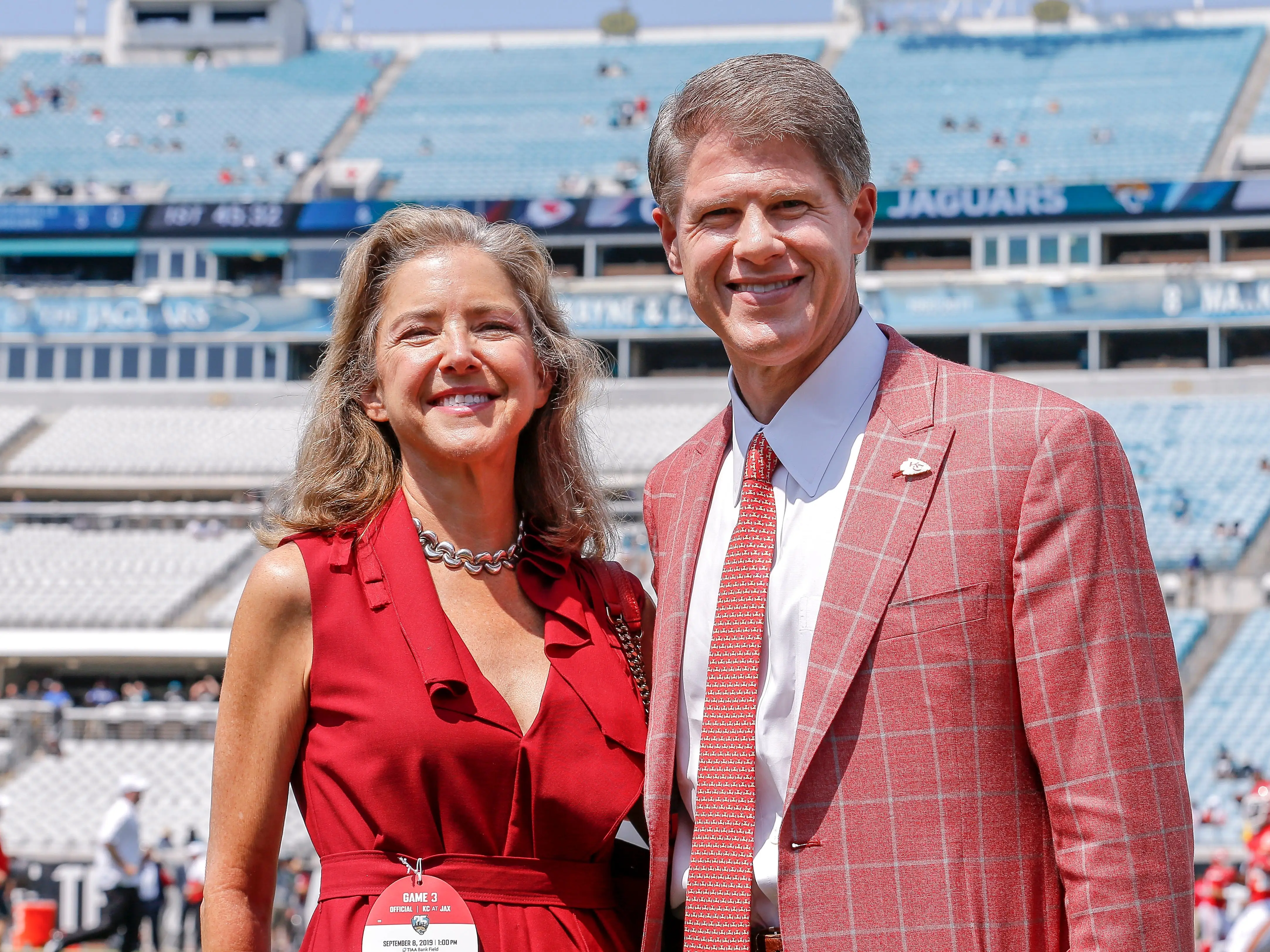 Lamar Hunt's children, Sharron Hunt Munson and Clark Hunt, on the sidelines of a Kansas City Chiefs game in 2019.