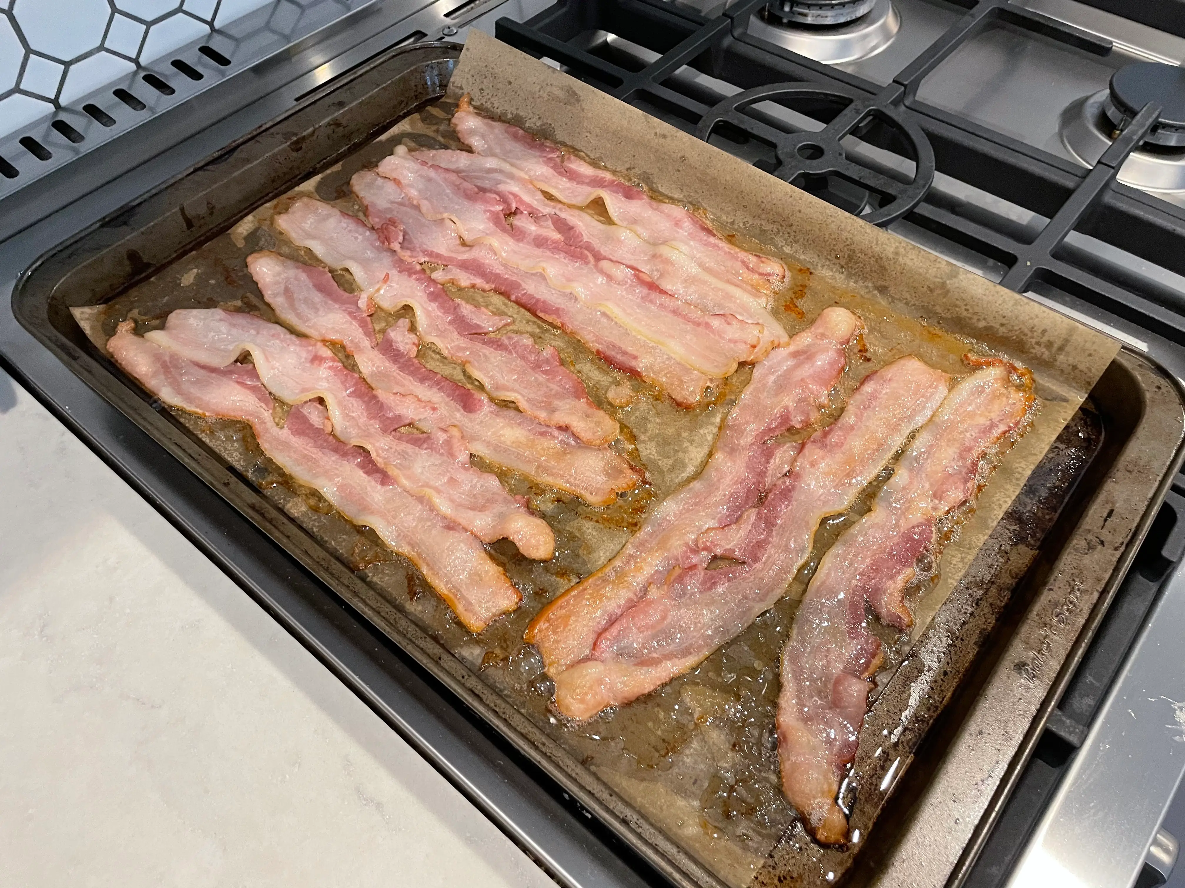 sizzling bacon on a sheetpan