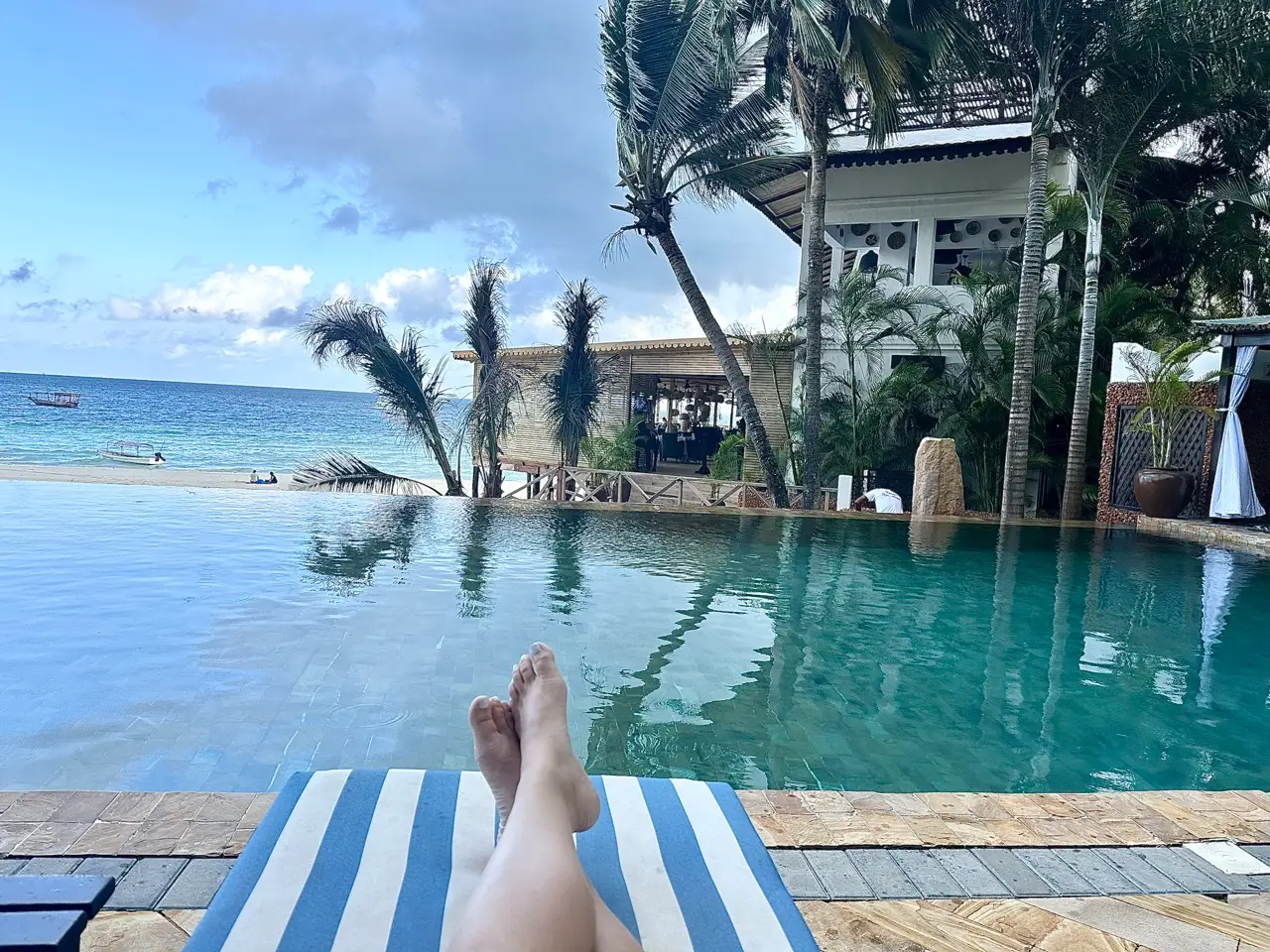 Author Jackie Longo lounging at pool at Z Hotel