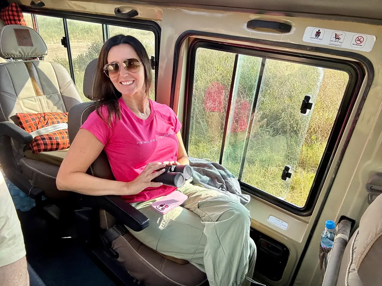Author Jackie Longo on safari in hot pink shirt