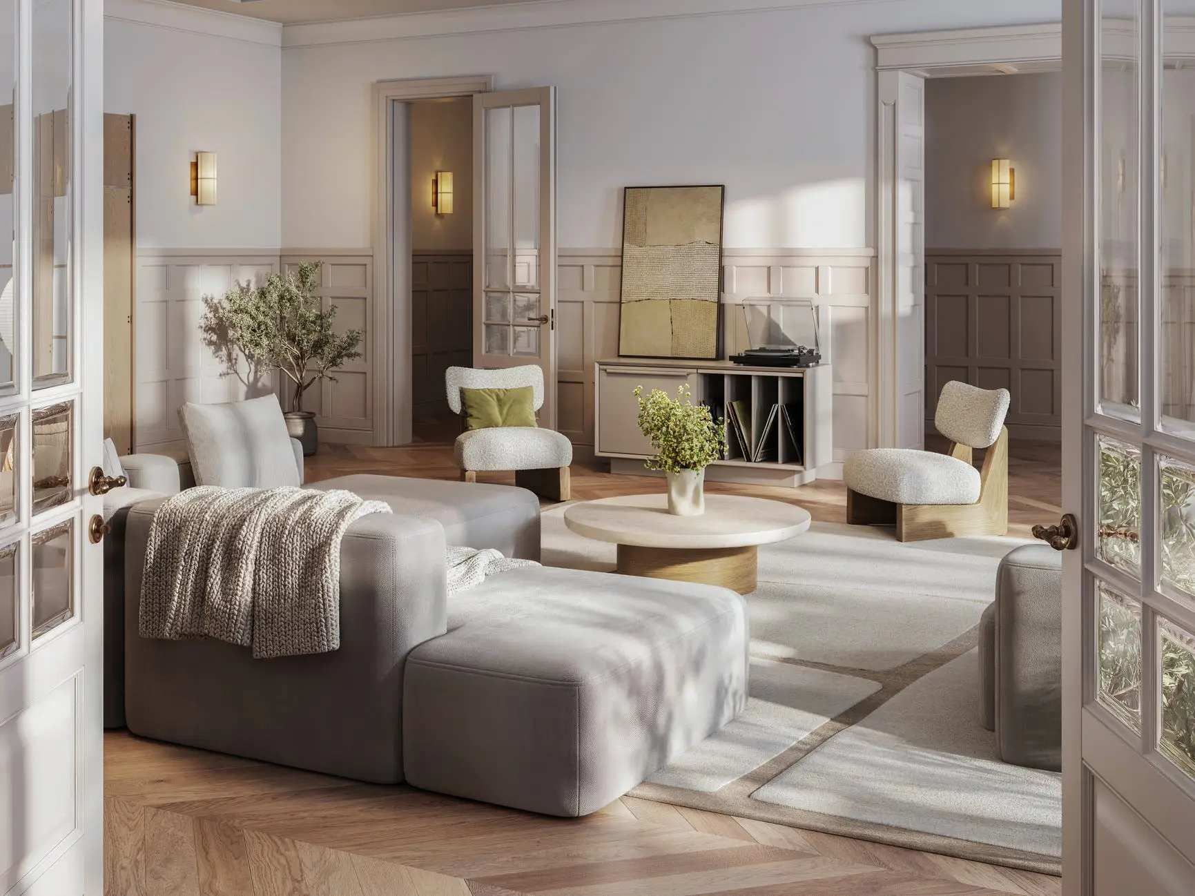 A white and tan living room with a light-gray couch, white cushioned chairs, a circular coffee table, and various plants