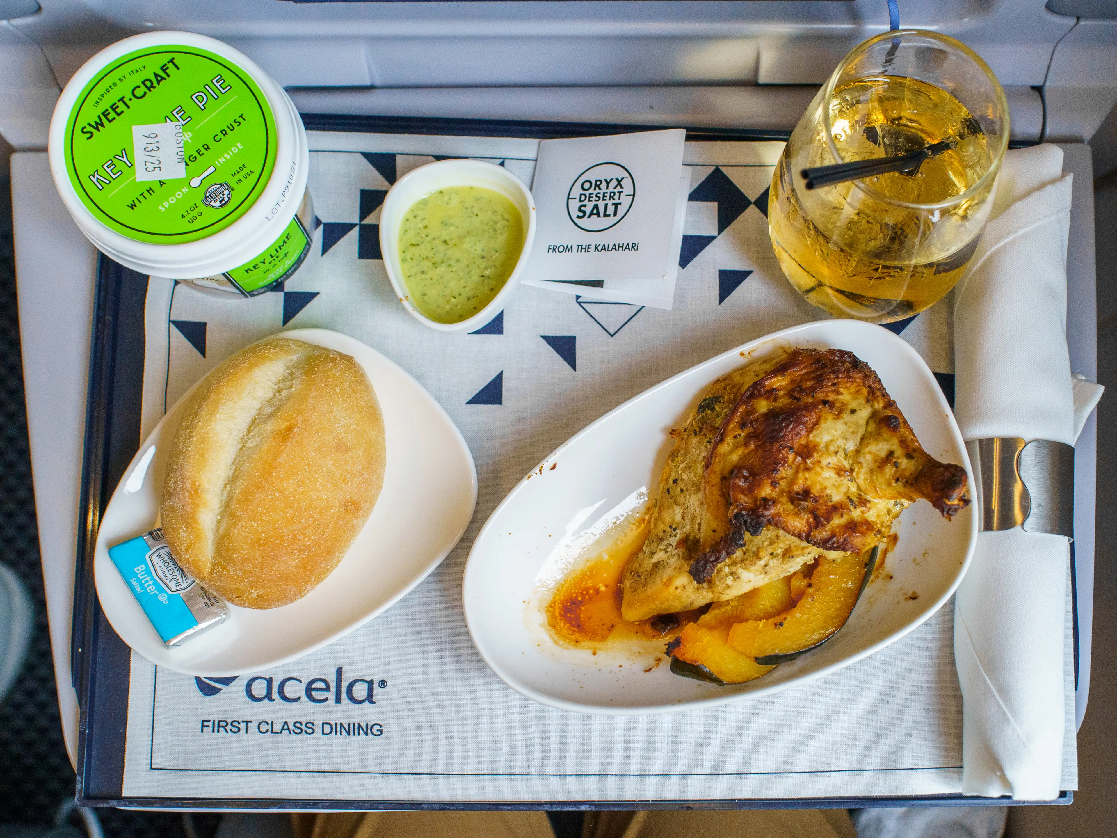 An aerial view of an Amtrak chicken dinner on a tray table